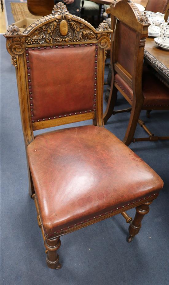 A set of seven late Victorian carved walnut dining chairs including one carver